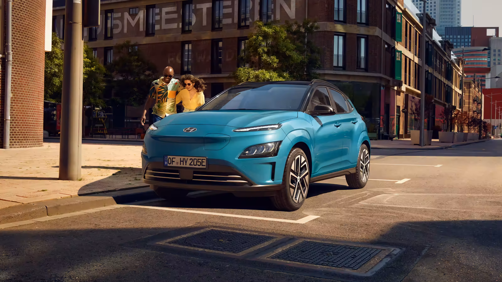 Woman walking away from her Hyundai IONIQ parked on the street.